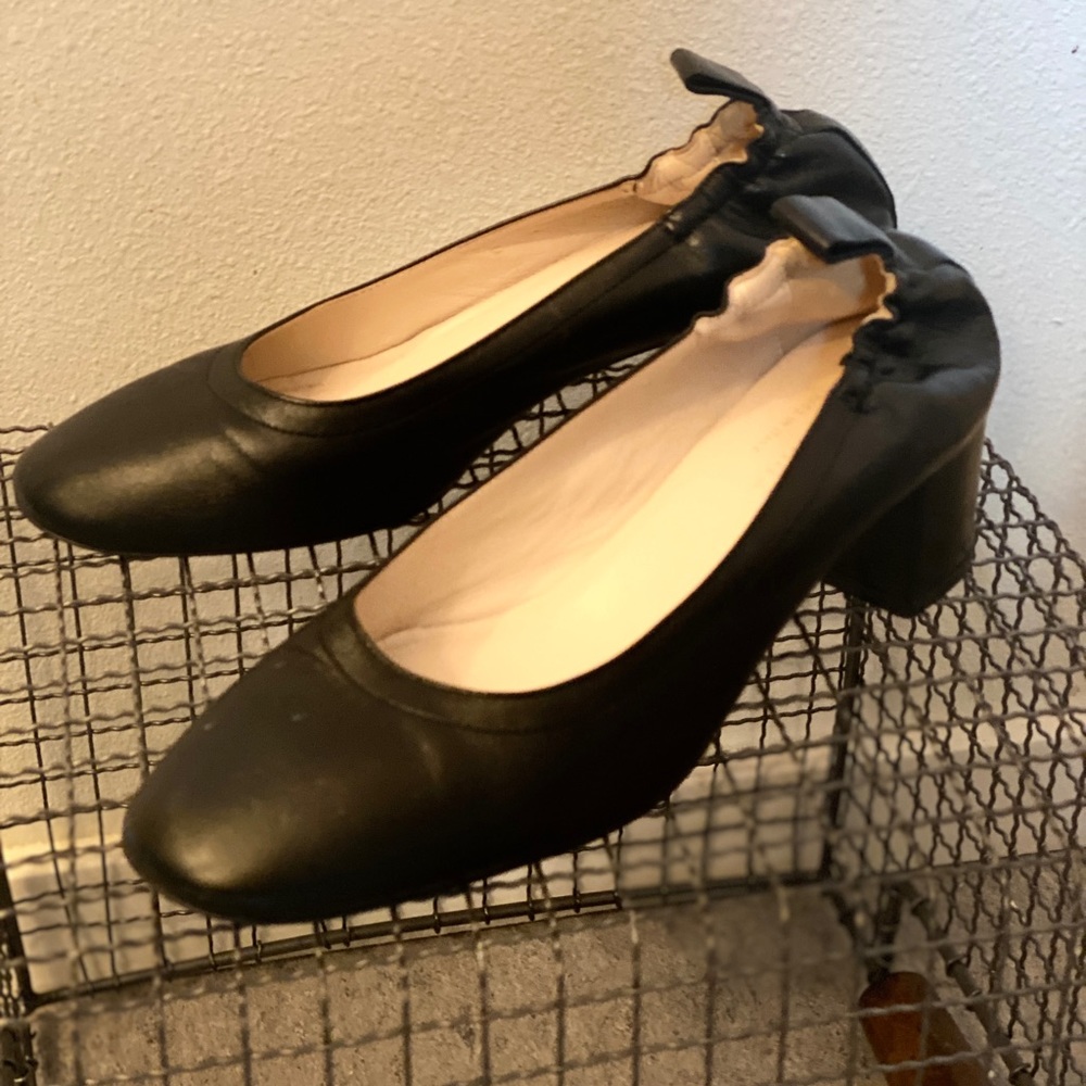 Only worn a few times.  A walkable two-inch block heel, and elasticized back.